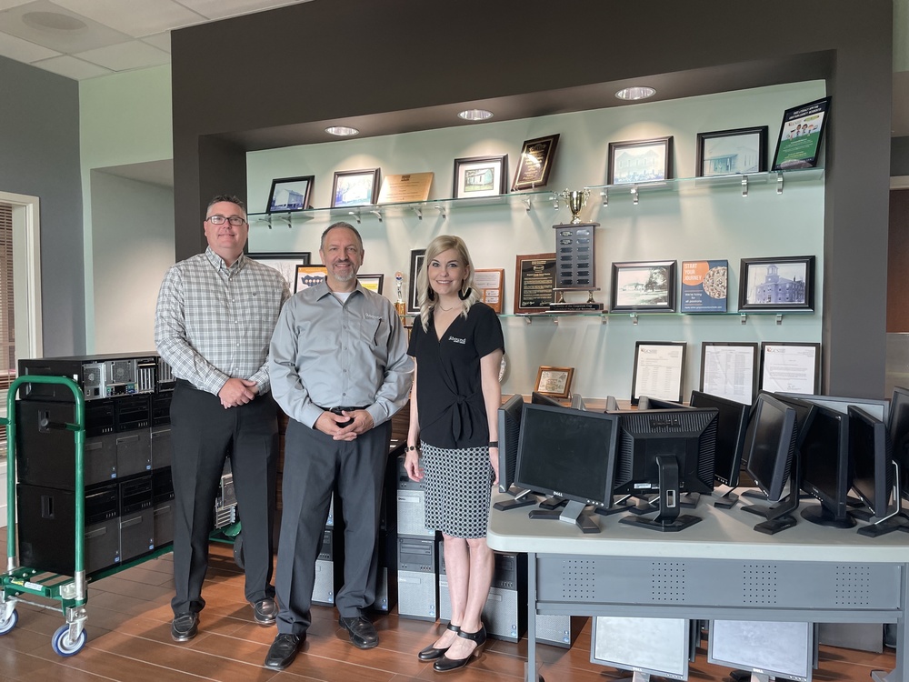 Doug Robinson, Dave Evangelista, Heidi Baldwin with PCs and monitors donated to GCS