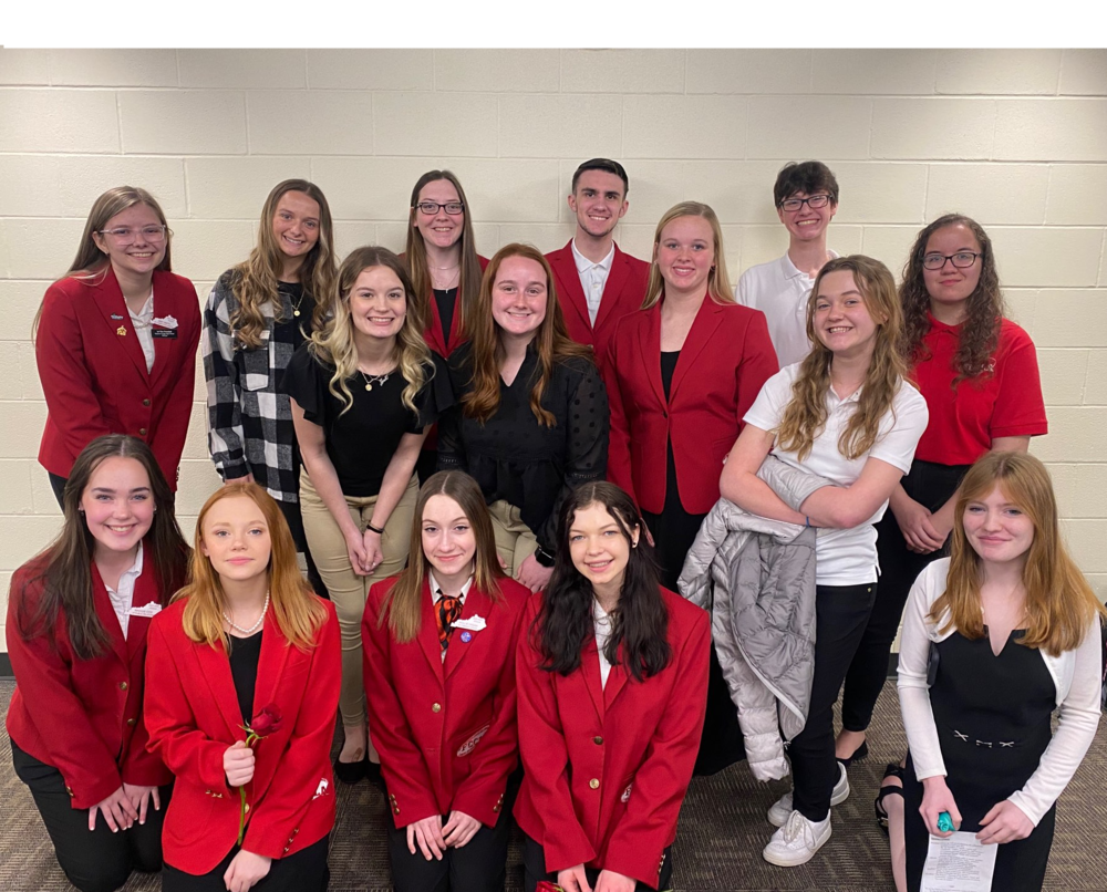 FCCLA members sitting or standing together in a group, most in FCCLA red blazers while at Region 5 meeting