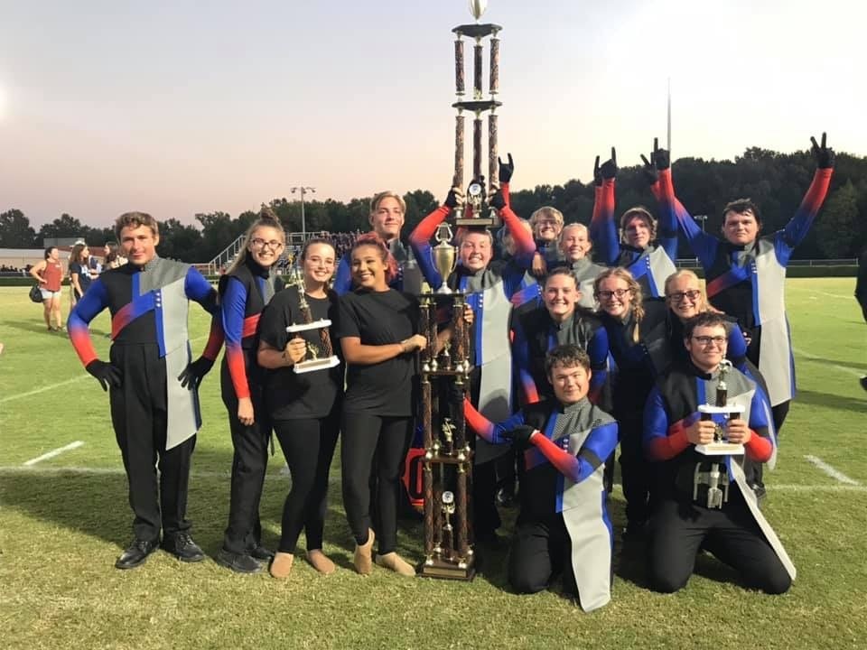 band members with trophy
