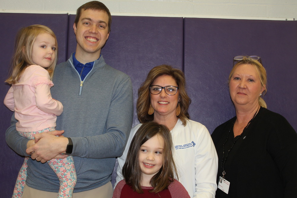 Dr. Bryce Meredith with Staff and his kids