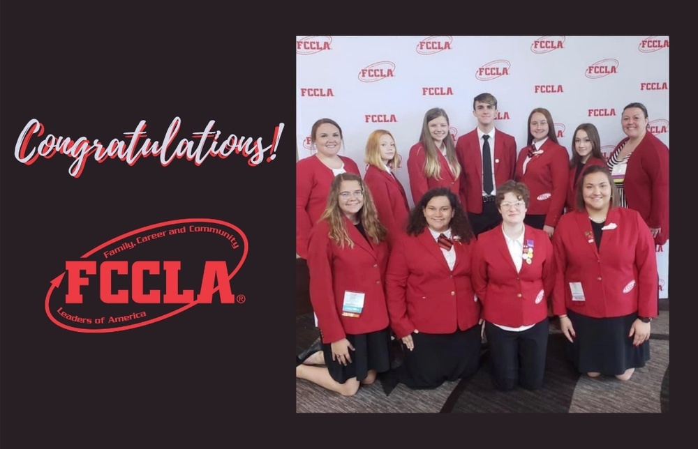 FCCLA Members at Nationals in front of a step and repeat FCCLA Banner