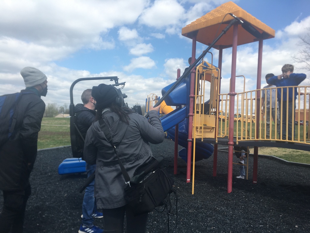 film crew with kids on playground