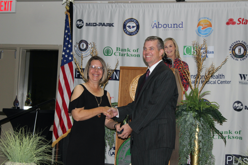 Matt Hayes receiving Education award from Chamber president Jennifer Priddy