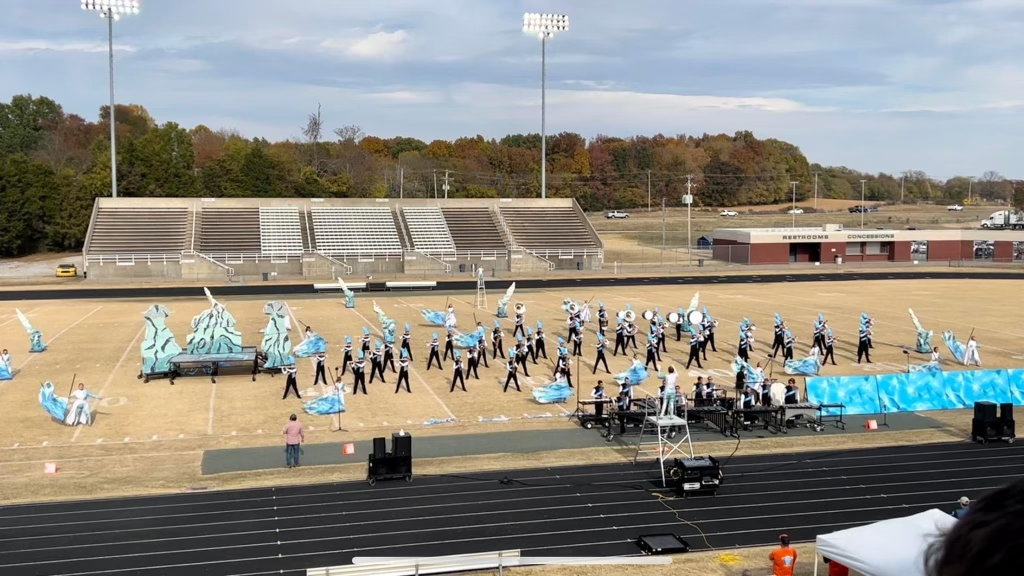GCHS Band in costume performing on football field